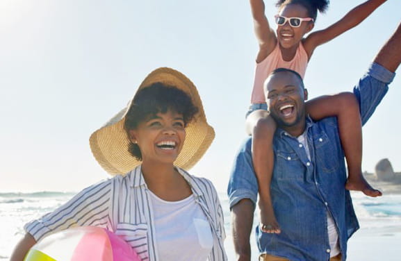 Family playing on beach