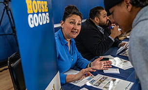 Golden 1 employee helping at financial education workshop.
