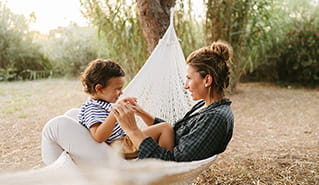 Mom and child in hammock. 