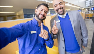 Two smiling Golden 1 employees posing for a selfie