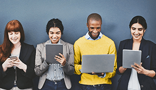 Group of people lined up on tablet, phone and laptop