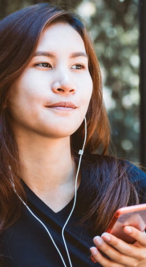 Woman listening to a podcast.