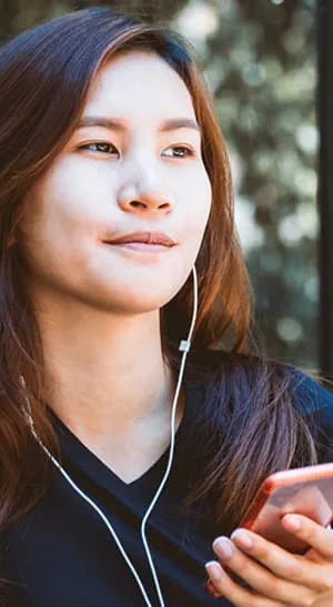 Woman listening to a podcast.