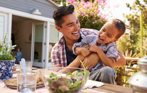 father and son enjoying their backyard